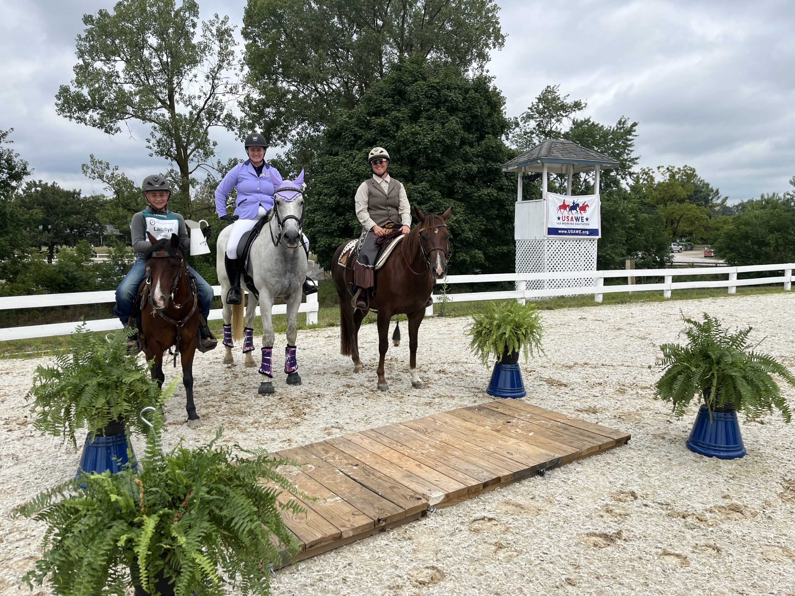 Demo riders lined up: Landyn Riddle with Rusty, Cera Olsen and Grey Joe Young, and Holly Linz on Pascal Toy Gunner